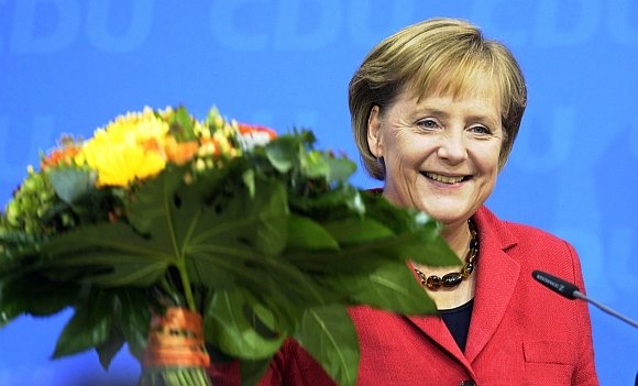 Angela Merkel švenčia pergalę.