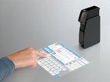 Gizmodo.com nuotr./Miniprojektorius &bdquo;Light touch&ldquo;.